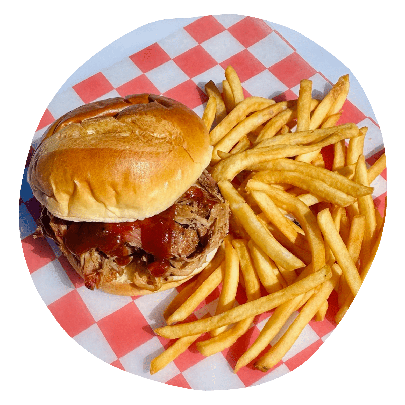Double cheeseburger on a picnic table.